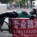 중국 대불황 속 이주노동자들의 어려운 상황 이미지
