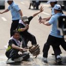Olympic Torch Protesters Attacked in South Korea - NYT 2008.4.28 이미지
