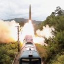 NK says ballistic missiles tested from new rail-borne system 이미지